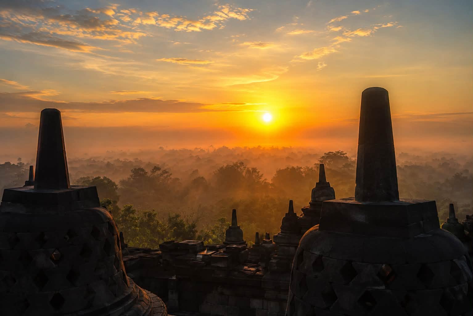 Sunrise over the stupas of Borobudur