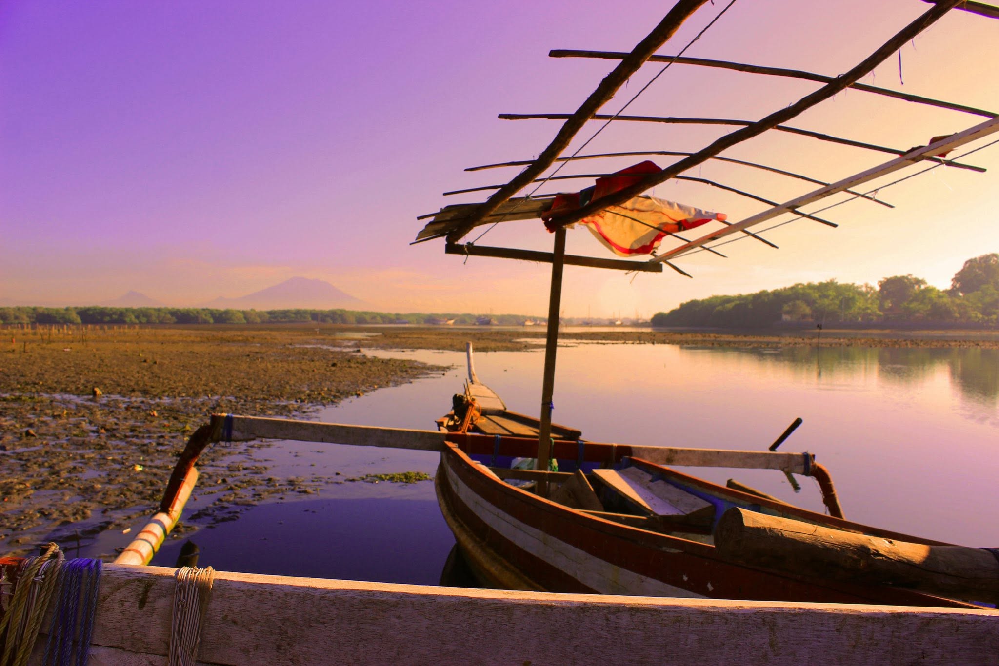 A traditional boat at sunset