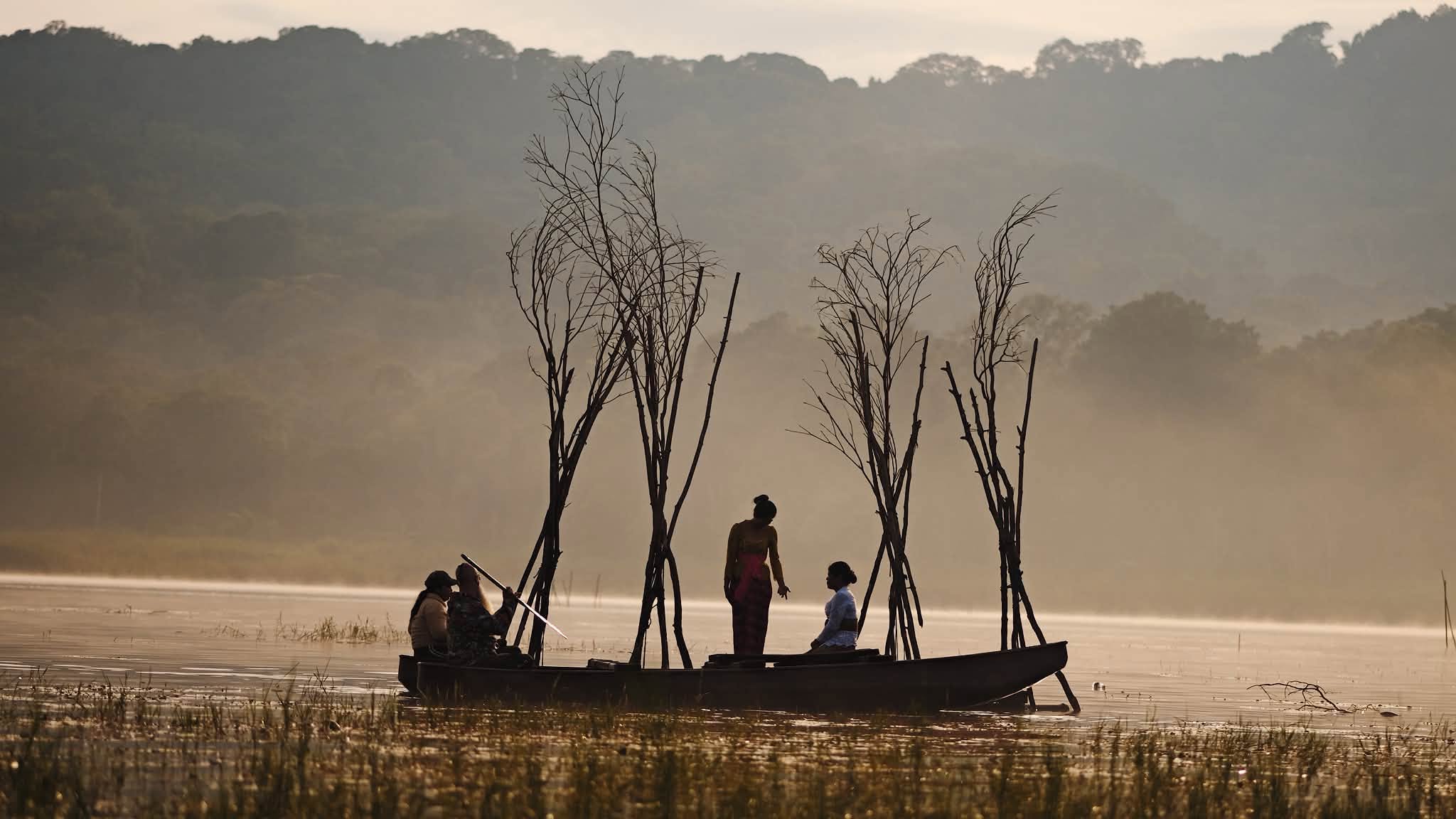 Fishermen in the mist at dawn